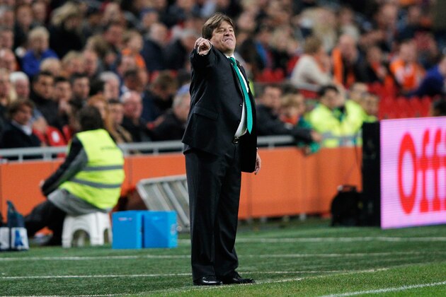 AMSTERDAM, NETHERLANDS - NOVEMBER 12:  Mexico Head Coach / Manager, Miguel Herrera gives his team instructions during the international friendly match between Netherlands and Mexico held at the Amsterdam ArenA on November 12, 2014 in Amsterdam, Netherlands.  (Photo by Dean Mouhtaropoulos/Getty Images)