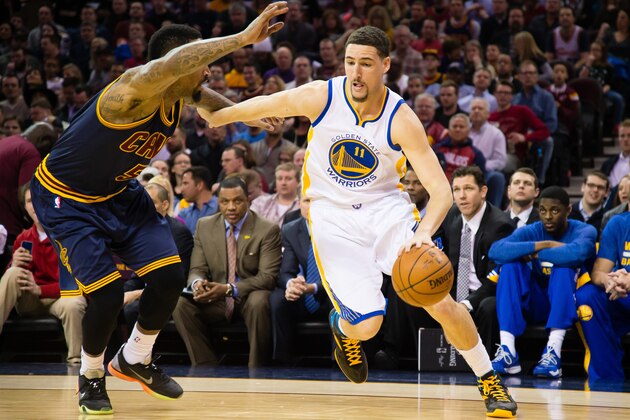 CLEVELAND, OH - FEBRUARY 26: J.R. Smith #5 of the Cleveland Cavaliers tries to stop Klay Thompson #11 of the Golden State Warriors during the first half at Quicken Loans Arena on February 26, 2015 in Cleveland, Ohio. NOTE TO USER: User expressly acknowledges and agrees that, by downloading and or using this photograph, User is consenting to the terms and conditions of the Getty Images License Agreement. (Photo by Jason Miller/Getty Images)