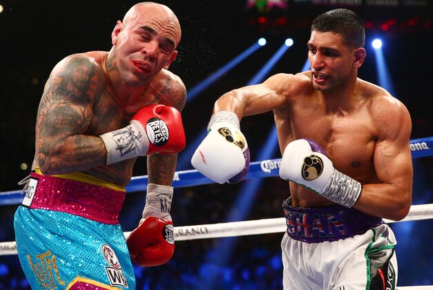 May 3, 2014; Las Vegas, NV, USA; Amir Khan lands a punch against Luis Collazo during their fight at MGM Grand. Mandatory Credit: Mark J. Rebilas-USA TODAY Sports