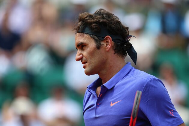PARIS, FRANCE - MAY 27:  Roger Federer of Switzerland looks on in his Men's Singles match against Marcel Granollers of Spain during day four of the 2015 French Open at Roland Garros on May 27, 2015 in Paris, France.  (Photo by Clive Mason/Getty Images)