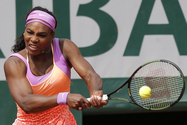 Serena Williams of the U.S.  returns the ball to Germany's Anna-Lena Friedsam during their second round match of the French Open tennis tournament at the Roland Garros stadium, Thursday, May 28, 2015 in Paris. Williams won 5-7, 6-3, -6-3. (AP Photo/Francois Mori)