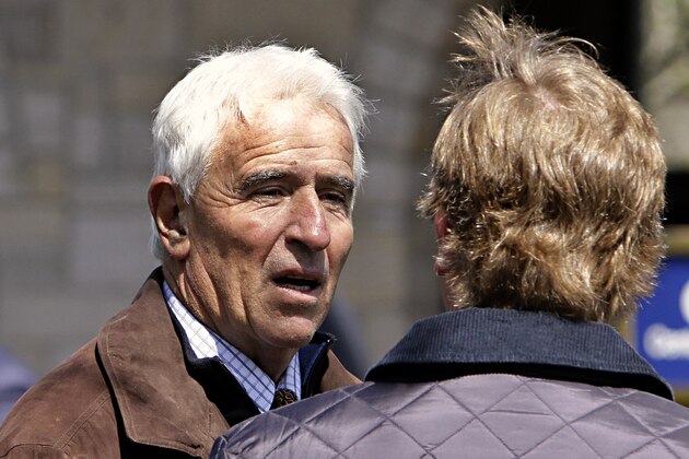 Trainer Nick Zito, left, talks with a bloodstock agent in the saddling paddock at Keeneland Race Course in Lexington, Ky., Saturday, April. 4, 2015 before the third race of the day. (AP Photo/Garry Jones)