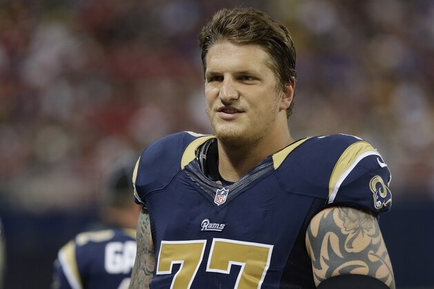 FILE - In this Aug. 17, 2013 file photo, St. Louis Rams tackle Jake Long (77) walks off the field during the fourth quarter of an NFL football game against the Green Bay Packers, in St. Louis. Long is helping a non-profit organization build a summer camp for chronic and life-threatening health challenged children. (AP Photo/Seth Perlman, File)
