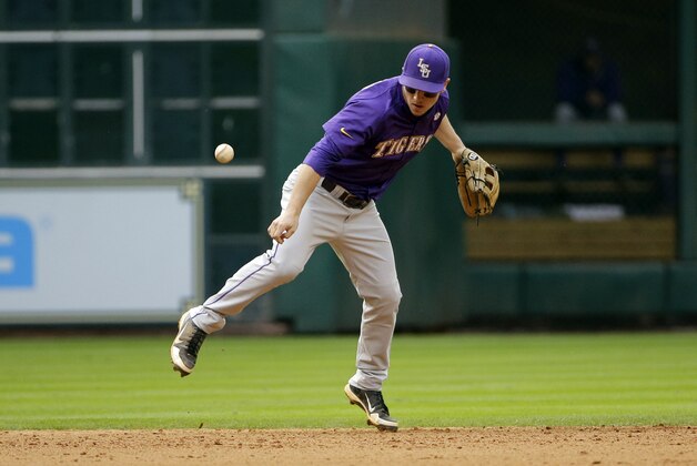 LSU shortstop Alex Bregman knocks down an infield hit by Baylor's Adam Toth during the sixth inning of an NCAA college baseball game Saturday, March 7, 2015, in Houston. (AP Photo/David J. Phillip)