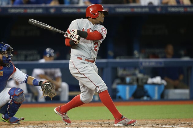 TORONTO, CANADA - MAY 19: Erick Aybar #2 of the Los Angeles Angels of Anaheim hits a single in the eighth inning during MLB game action against the Toronto Blue Jays on May 19, 2015 at Rogers Centre in Toronto, Ontario, Canada. (Photo by Tom Szczerbowski/Getty Images)