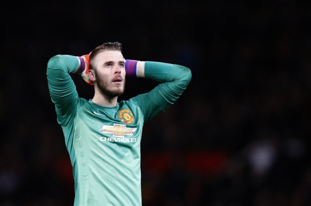 Manchester United’s goalkeeper David De Gea looks up at the end of  the English FA Cup quarterfinal soccer match between Manchester United and Arsenal at Old Trafford Stadium, Manchester, England, Monday, March 9, 2015. Arsenal won the game 2-1.(AP Photo/Jon Super)