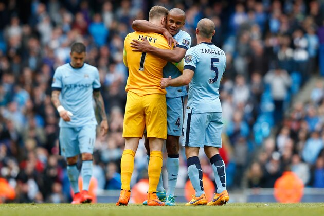 MANCHESTER, ENGLAND - MAY 24:  (L to R) Joe Hart, Vincent Kompany and Pablo Zabaleta of Manchester City celebrate after the Barclays Premier League match between Manchester City and Southampton at Etihad Stadium on May 24, 2015 in Manchester, England.  (Photo by Dean Mouhtaropoulos/Getty Images)