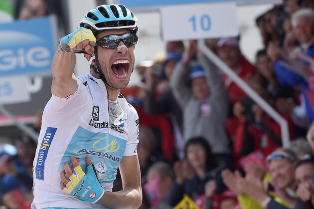 Italy's Fabio Aru celebrates as he crosses the finish line to win the 19th stage of the Giro d'Italia, Tour of Italy cycling race from Gravellona Toce to Cervinia, Friday, May 29, 2015. (Daniel Dal Zennaro/ANSA via AP) ITALY OUT