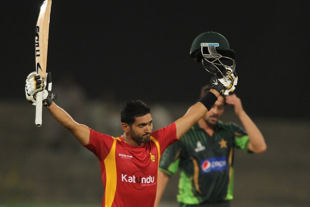 Zimbabwe's Sikandar Raza celebrates his century against Pakistan during the second one-day international at the Gaddafi stadium in Lahore, Pakistan, Friday, May 29, 2015. (AP Photo/K.M. Chaudary)