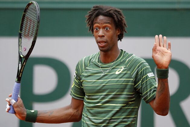 France's Gael Monfils gestures in his third round match of the French Open tennis tournament against Uruguay's Pablo Cuevas at the Roland Garros stadium, in Paris, France, Friday, May 29, 2015. (AP Photo/Francois Mori)