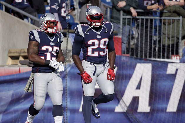 New England Patriots running backs Jonas Gray (35) and LeGarrette Blount (29) warm up before an NFL football game against the Detroit Lions Sunday, Nov. 23, 2014, in Foxborough, Mass. (AP Photo/Steven Senne)