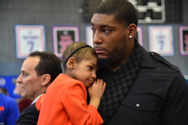 NEW YORK, NY - FEBRUARY 13:  Devon Still of the Cincinnati Bengals and his daughter Leah Sari look on at High School of Graphic Communication & Arts on February 13, 2015 in New York, New York  NOTE TO USER: User expressly acknowledges and agrees that, by downloading and/or using this Photograph, user is consenting to the terms and conditions of the Getty Images License Agreement. Mandatory Copyright Notice: Copyright 2015 NBAE (Photo by Jesse D. Garrabrant/NBAE via Getty Images)
