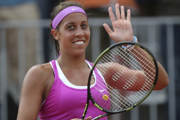 Madison Keys of the U.S. waves after defeating Belinda Bencic of Switzerland in their second round match of the French Open tennis tournament at the Roland Garros stadium, Thursday, May 28, 2015 in Paris,  (AP Photo/David Vincent)