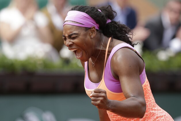 Serena Williams of the U.S. celebrates winning the second round match of the French Open tennis tournament against Germany's Anna-Lena Friedsam in three sets 5-7, 6-3, 6-3, at the Roland Garros stadium, in Paris, France, Thursday, May 28, 2015. (AP Photo/Thibault Camus)