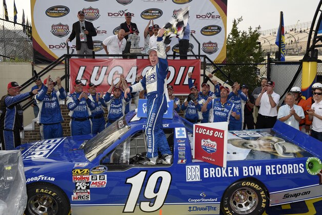 Tyler Reddick celebrates his win in the NASCAR Truck series auto race, Friday, May 29, 2015, at Dover International Speedway in Dover, Del. (AP Photo/Nick Wass)