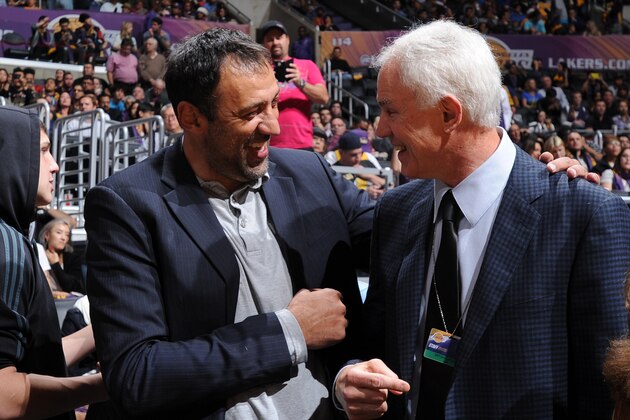 LOS ANGELES, CA - DECEMBER 23: Former player Vlade Divac and General Manager Mitch Kupchak speak before a game against the Golden State Warriors and Los Angeles Lakers at STAPLES Center on December 23, 2014 in Los Angeles, California. NOTE TO USER: User expressly acknowledges and agrees that, by downloading and/or using this Photograph, user is consenting to the terms and conditions of the Getty Images License Agreement. Mandatory Copyright Notice: Copyright 2014 NBAE (Photo by Andrew D. Bernstein/NBAE via Getty Images)
