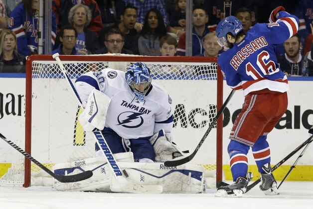 Tampa Bay Lightning goalie Ben Bishop (30) blocks a shot by New York Rangers center Derick Brassard (16) during the third period of Game 7 of the Eastern Conference final during the NHL hockey Stanley Cup playoffs, Friday, May 29, 2015, in New York.  (AP Photo/Frank Franklin)