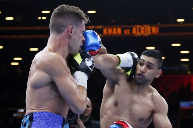 Amir Khan, right, fights against Chris Algieri during the second round of a boxing bout, Friday, May 29, 2015, in New York. (AP Photo/Julio Cortez)