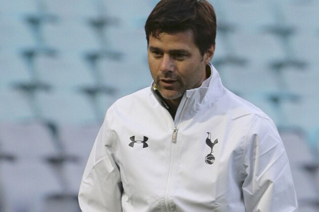 Tottenham Hotspur head coach Mauricio Pochettino walks around the field during an open training session in Sydney Friday, May 29, 2015. The Hotspur will play against Sydney FC in their friendly soccer match in Sydney on Saturday, May 30. (AP Photo/Rob Griffith)