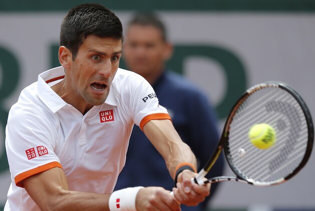 Serbia's Novak Djokovic returns the ball to Thanasi Kokkinakis of Australia during their third round match of the French Open tennis tournament at the Roland Garros stadium, Saturday, May 30, 2015 in Paris.  (AP Photo/Francois Mori)