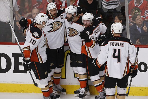 Anaheim Ducks left wing Patrick Maroon, third from left, celebrates his goal against the Chicago Blackhawks during the second period in Game 6 of the Western Conference finals of the NHL hockey Stanley Cup playoffs, Wednesday, May 27, 2015, in Chicago. (AP Photo/Charles Rex Arbogast)