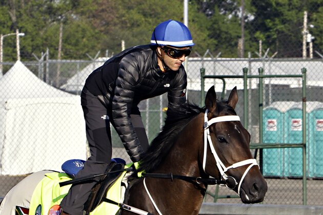 Jockey Christophe Soumillon tests the track at Churchill Downs in Louisville, Ky., Wednesday, April 29, 2015, aboard his Kentucky Derby hopeful Mubtaahij.  (AP Photo/Garry Jones)