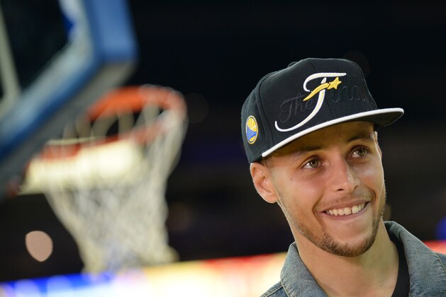 OAKLAND, CA - MAY 27: Stephen Curry #30 of the Golden State Warriors speaks to the media after Game Five of the Western Conference Finals of the 2015 NBA Playoffs against the Houston Rockets on May 27, 2015 at Oracle Arena in Oakland, California. NOTE TO USER: User expressly acknowledges and agrees that, by downloading and or using this photograph, user is consenting to the terms and conditions of Getty Images License Agreement. Mandatory Copyright Notice: Copyright 2015 NBAE (Photo by Noah Graham/NBAE via Getty Images)