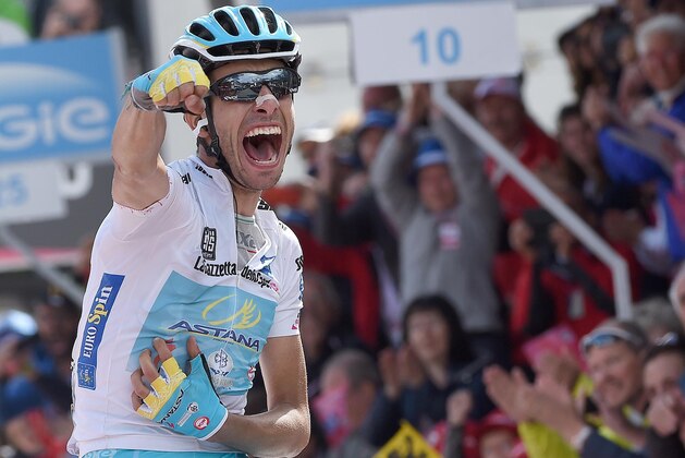 Italy's Fabio Aru celebrates as he crosses the finish line to win the 19th stage of the Giro d'Italia, Tour of Italy cycling race from Gravellona Toce to Cervinia, Friday, May 29, 2015. (Daniel Dal Zennaro/ANSA via AP) ITALY OUT