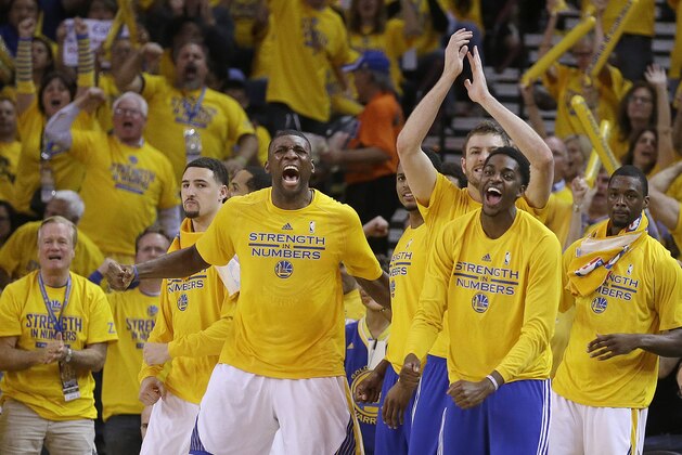 Golden State Warriors players react during the second half of Game 5 of the NBA basketball Western Conference finals against the Houston Rockets in Oakland, Calif., Wednesday, May 27, 2015. (AP Photo/Ben Margot)