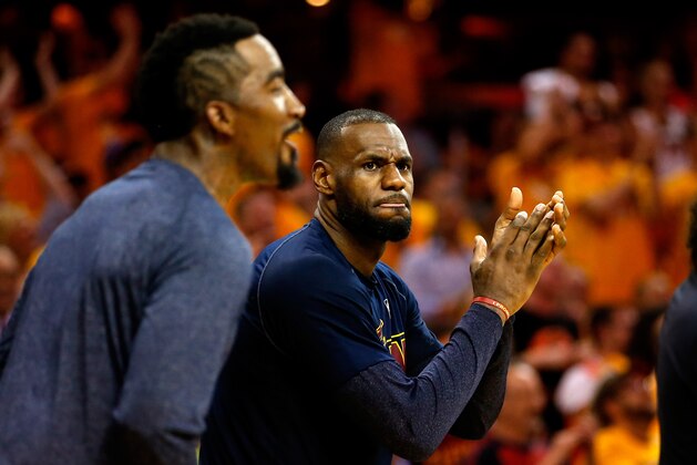 CLEVELAND, OH - MAY 26: LeBron James #23 of the Cleveland Cavaliers reacts with J.R. Smith #5 late in the fourth quarter against the Atlanta Hawks during Game Four of the Eastern Conference Finals of the 2015 NBA Playoffs at Quicken Loans Arena on May 26, 2015 in Cleveland, Ohio. NOTE TO USER: User expressly acknowledges and agrees that, by downloading and or using this Photograph, user is consenting to the terms and conditions of the Getty Images License Agreement.  (Photo by Gregory Shamus/Getty Images)