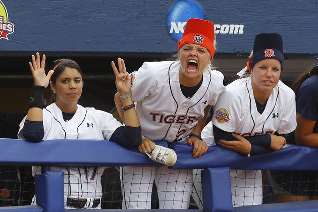 Auburn's Victoria Draper, center, shouts from the dugout in the seventh inning of a game against LSU in the NCAA Women's College World Series softball tournament in Oklahoma City, Thursday, May 28, 2015. LSU won 6-1. (AP Photo/Sue Ogrocki)