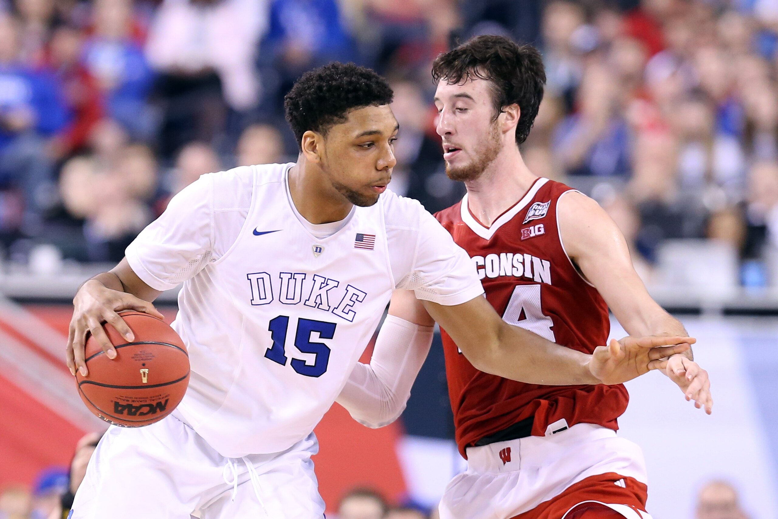 INDIANAPOLIS, IN - APRIL 06: Jahlil Okafor #15 of the Duke Blue Devils handles the ball against Frank Kaminsky #44 of the Wisconsin Badgers in the second half during the NCAA Men's Final Four National Championship at Lucas Oil Stadium on April 6, 2015 in Indianapolis, Indiana.  (Photo by Streeter Lecka/Getty Images)