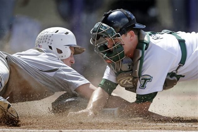 Lehigh's Patrick Donnelly reaches the plate safely against Tulane catcher Jake Rogers in the first inning of a game at the Baton Rouge Regional of the NCAA college baseball tournament in Baton Rouge, La., Saturday, May 30, 2015. (AP Photo/Gerald Herbert)