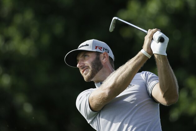 Dustin Johnson watches his tee shot on the 18th hole during the third round of the Byron Nelson golf tournament, Saturday, May 30, 2015, in Irving, Texas. (AP Photo/LM Otero)
