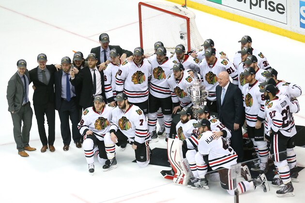 ANAHEIM, CA - MAY 30:  The Chicago Blackhawks pose in front of the Clarence S. Campbell Bowl after the Blackhawks 5-3 victory against the Anaheim Ducks in Game Seven of the Western Conference Finals during the 2015 NHL Stanley Cup Playoffs  at the Honda Center on May 30, 2015 in Anaheim, California.  (Photo by Stephen Dunn/Getty Images)