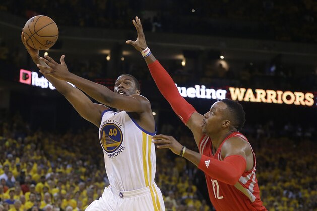 Golden State Warriors forward Harrison Barnes (40) shoots against Houston Rockets center Dwight Howard (12) during the second half of Game 5 of the NBA basketball Western Conference finals in Oakland, Calif., Wednesday, May 27, 2015. (AP Photo/Ben Margot)