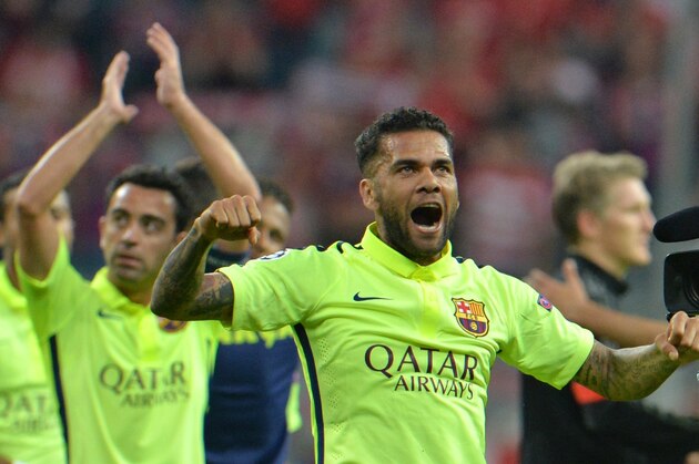 Barcelona's Dani Alves celebrates at the end of the soccer Champions League second leg semifinal match between Bayern Munich and FC Barcelona at Allianz Arena in Munich, southern Germany, Tuesday, May 12, 2015. (AP Photo/Kerstin Joensson)