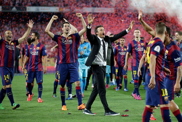 Barcelona’s head coach Luis Enrique, center, celebrates after winning the final of the Copa del Rey soccer match between FC Barcelona and Athletic Bilbao at the Camp Nou stadium in Barcelona, Spain, Saturday, May 30, 2015. (AP Photo/Manu Fernandez)