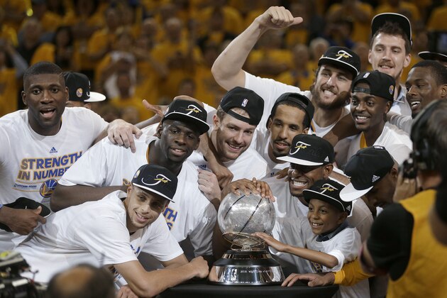 Golden State Warriors players celebrate after Game 5 of the NBA basketball Western Conference finals against the Houston Rockets in Oakland, Calif., Wednesday, May 27, 2015. The Warriors won 104-90 and advanced to the NBA Finals. (AP Photo/Ben Margot)