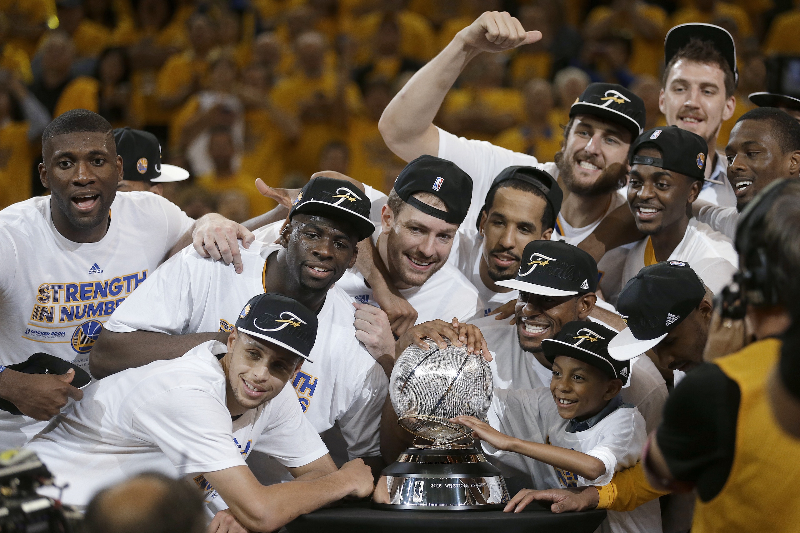 Golden State Warriors players celebrate after Game 5 of the NBA basketball Western Conference finals against the Houston Rockets in Oakland, Calif., Wednesday, May 27, 2015. The Warriors won 104-90 and advanced to the NBA Finals. (AP Photo/Ben Margot)