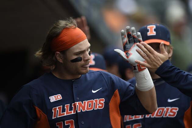 Illinois' David Kerian (12) celebrates a home run against Michigan during the sixth inning of a fourth-round NCAA Big Ten tournament college baseball game Saturday, May 23, 2015, in Minneapolis. Michigan won 5-3. (AP Photo/Hannah Foslien)