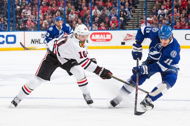 TAMPA, FL - FEBRUARY 27: Brian Boyle #11 of the Tampa Bay Lightning skates against Patrick Sharp #10 of the Chicago Blackhawks during the second period at the Amalie Arena on February 27, 2015 in Tampa, Florida.  (Photo by Scott Audette/NHLI via Getty Images)