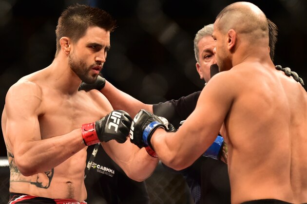 May 30, 2015; Goiania, GO, Brazil; Carlos Condit (red gloves) fights Thiago Alves (blue gloves) during UFC Fight Night at Goiania Arena. Mandatory Credit: Jason Silva-USA TODAY Sports