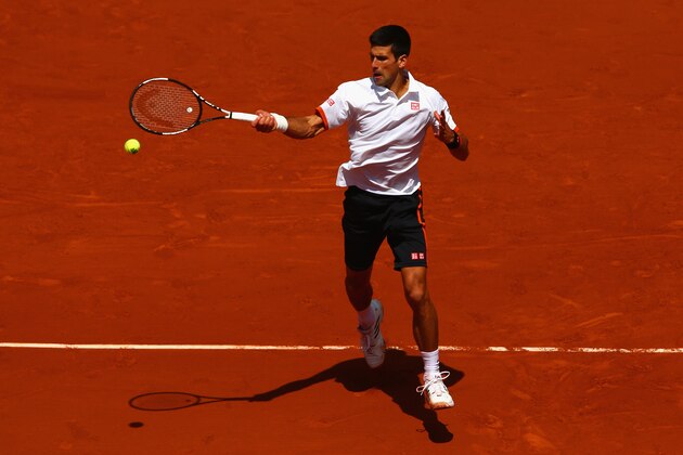 PARIS, FRANCE - MAY 30:  Novak Djokovic of Serbia plays a forehand in his Men's Singles match against Thanasi Kokkinakis of Australia on day seven of the 2015 French Open at Roland Garros on May 30, 2015 in Paris, France.  (Photo by Clive Mason/Getty Images)