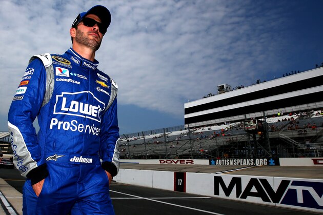 DOVER, DE - MAY 29:  Jimmie Johnson, driver of the #48 Lowe's Pro Services Chevrolet, walks on the grid during qualifying for the NASCAR Sprint Cup Series FedEx 400 Benefiting Autism Speaks at Dover International Speedway on May 29, 2015 in Dover, Delaware.  (Photo by Sean Gardner/Getty Images)