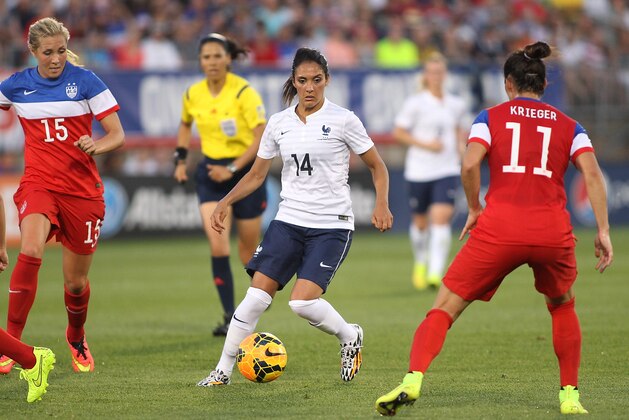 EAST HARTFORD, CT - JUNE 19:  Louisa Necib #14 of France tries to keep the ball from the United States defense during a game between France and the United States June 19, 2014 at Rentschler Field in East Hartford, Connecticut.  (Photo by Gail Oskin/Getty Images)