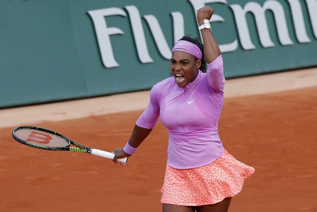 Serena Williams of the U.S. celebrates winning her the third round match of the French Open tennis tournament in three sets 3-6, 6-4, 6-2, against Victoria Azarenka of Belarus at the Roland Garros stadium, in Paris, France, Saturday, May 30, 2015. (AP Photo/Christophe Ena)