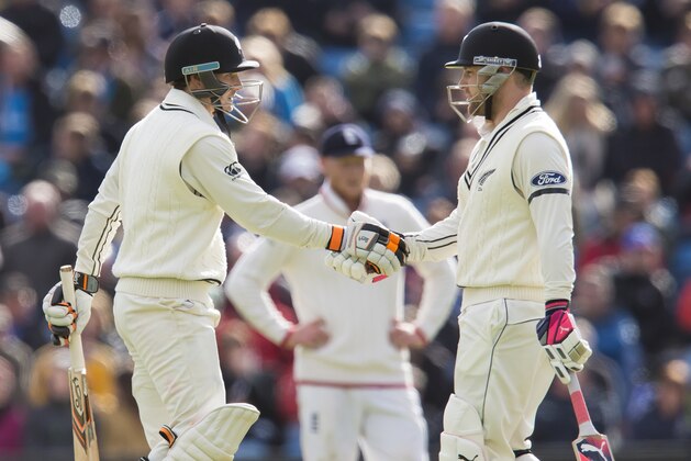 New Zealand's BJ Watling, left, shakes hands with captain  Brendon McCullum after reaching 50 on the third day of the second Test match between England and New Zealand at Headingley cricket ground in Leeds, England, Sunday, May 31, 2015.(AP Photo/Jon Super)