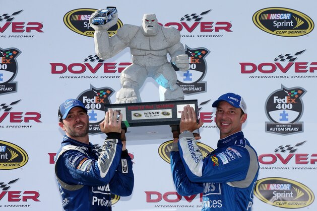 DOVER, DE - MAY 31: Jimmie Johnson, driver of the #48 Lowe's Pro Services Chevrolet, left, and crew chief Chad Knaus lift the Miles the Monster trophy in Victory Lane after winning the NASCAR Sprint Cup Series FedEx 400 Benefiting Autism Speaks at Dover International Speedway on May 31, 2015 in Dover, Delaware. (Photo by Sean Gardner/Getty Images) DOVER, DE - MAY 31: Jimmie Johnson, driver of the #48 Lowe's Pro Services Chevrolet, left, and crew chief Chad Knaus lift the Miles the Monster trophy in Victory Lane after winning the NASCAR Sprint Cup Series FedEx 400 Benefiting Autism Speaks at Dover International Speedway on May 31, 2015 in Dover, Delaware. (Photo by Sean Gardner/Getty Images)