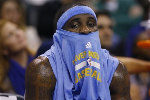 Denver Nuggets guard Ty Lawson sits on the bench in the third quarter of an NBA basketball game against the Oklahoma City Thunder, Sunday, Feb. 22, 2015, in Oklahoma City. Oklahoma City won 119-94. (AP Photo/Sue Ogrocki)